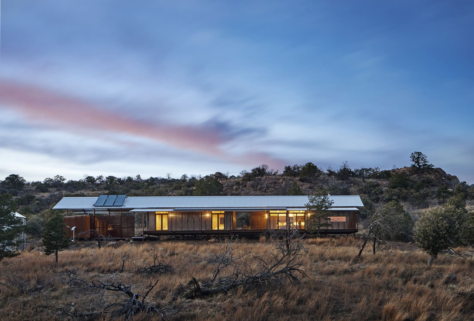 A modern OpenHome from Lake Flato at dusk