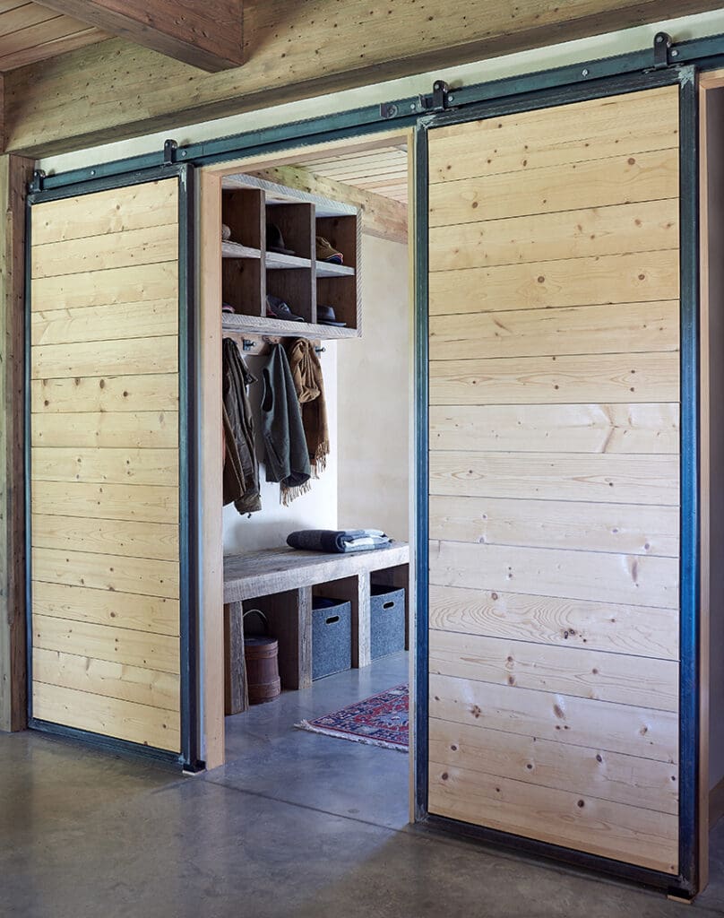 A sliding door closet with the doors open