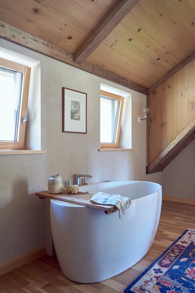 Soaking tub in a rustic bathroom