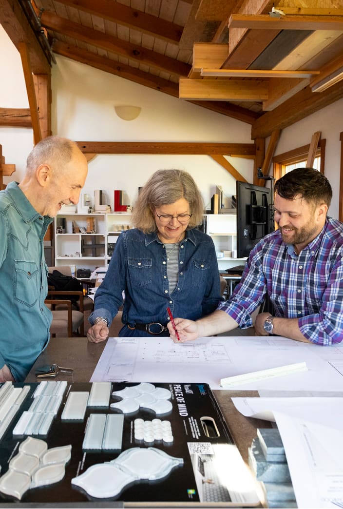 Clients review plans with architect