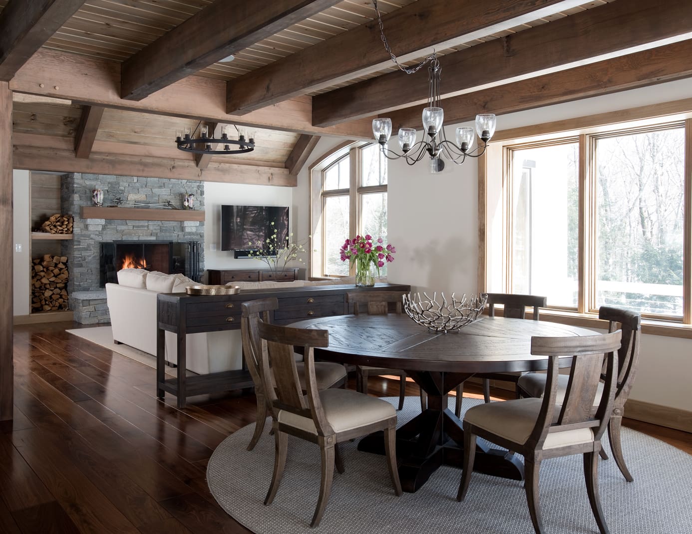Exposed timber ceiling over a dining room table