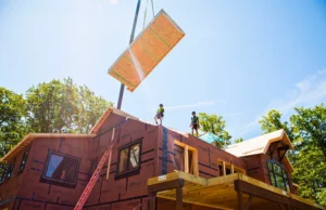 Bensonwood wall system being positioned by the on-site team